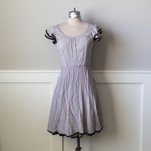 Anthro cream with black trim flutter sleeve dress